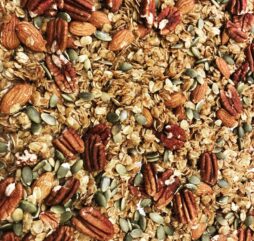 Granola up close with pecans and other pieces to start your day off right