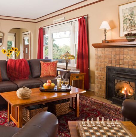 A nice family room area is designed for comfort with a chess board and fireplace