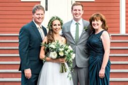 The innkeeper stands proudly with her two sons and new daughter in law at the wedding